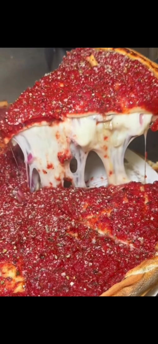 A generous cheese pull from a Hello Chicago deep-dish pizza